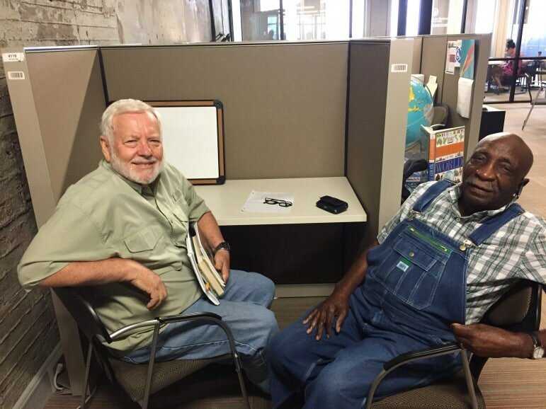 Literacy Council tutor James Mersmann, left, and Mr. Fred take a break from lessons and good-natured trash talking. Credit: Dan Carsen / WBHM.